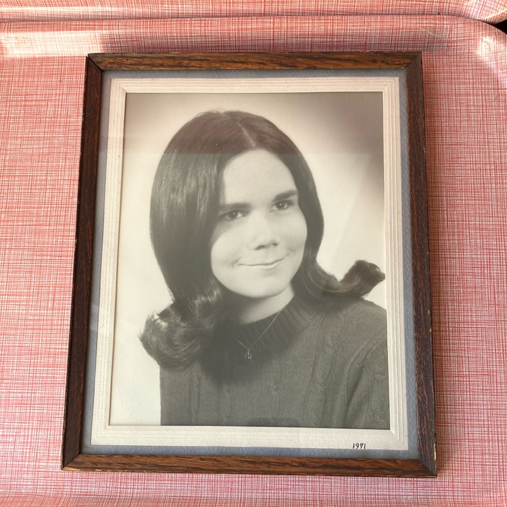 Vintage framed photo portrait of a young woman